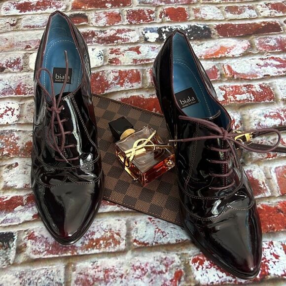 Biala dark brown patent heeled booties with a maroon tint and front laces - Picture 1 of 8